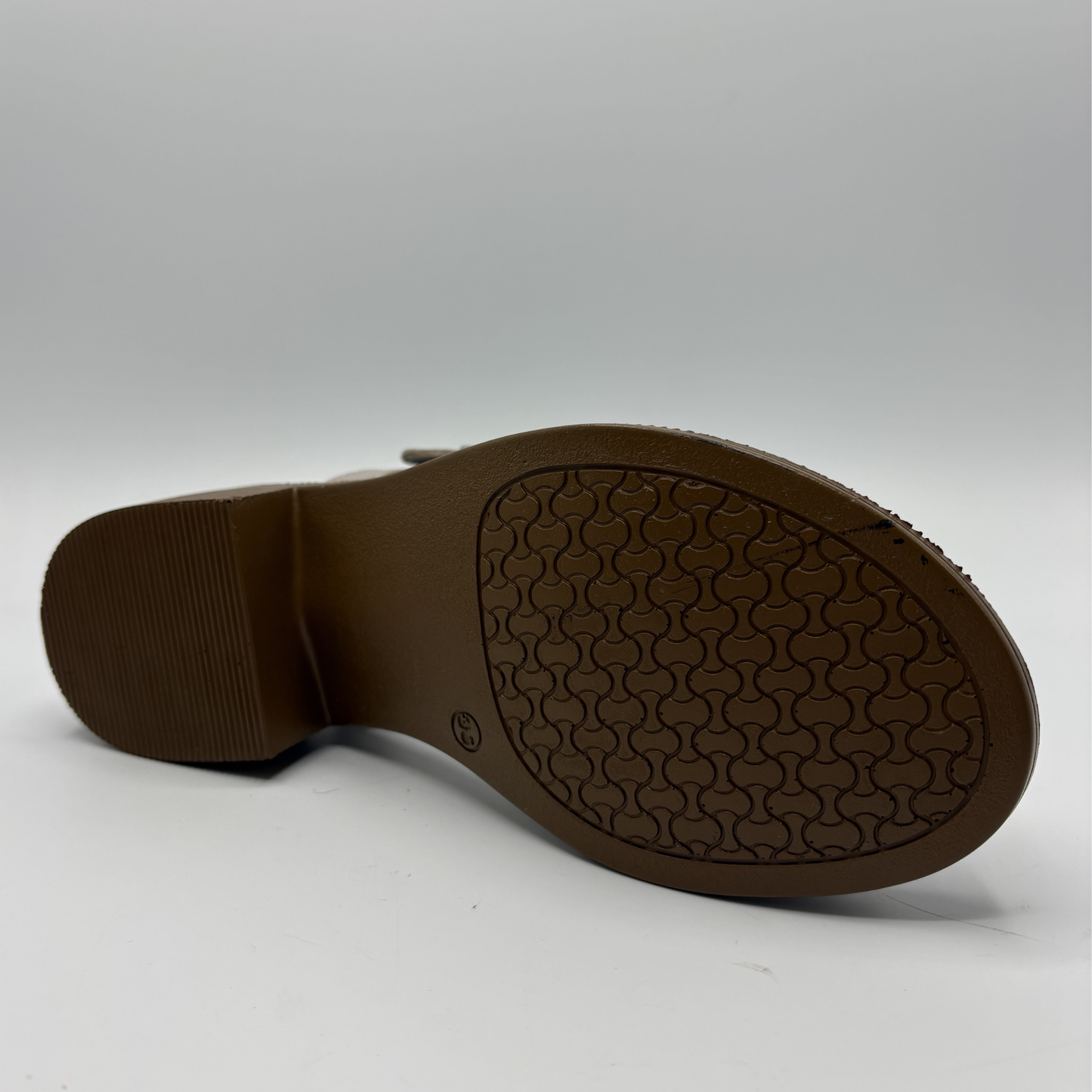 Brown shoe sole on a white background