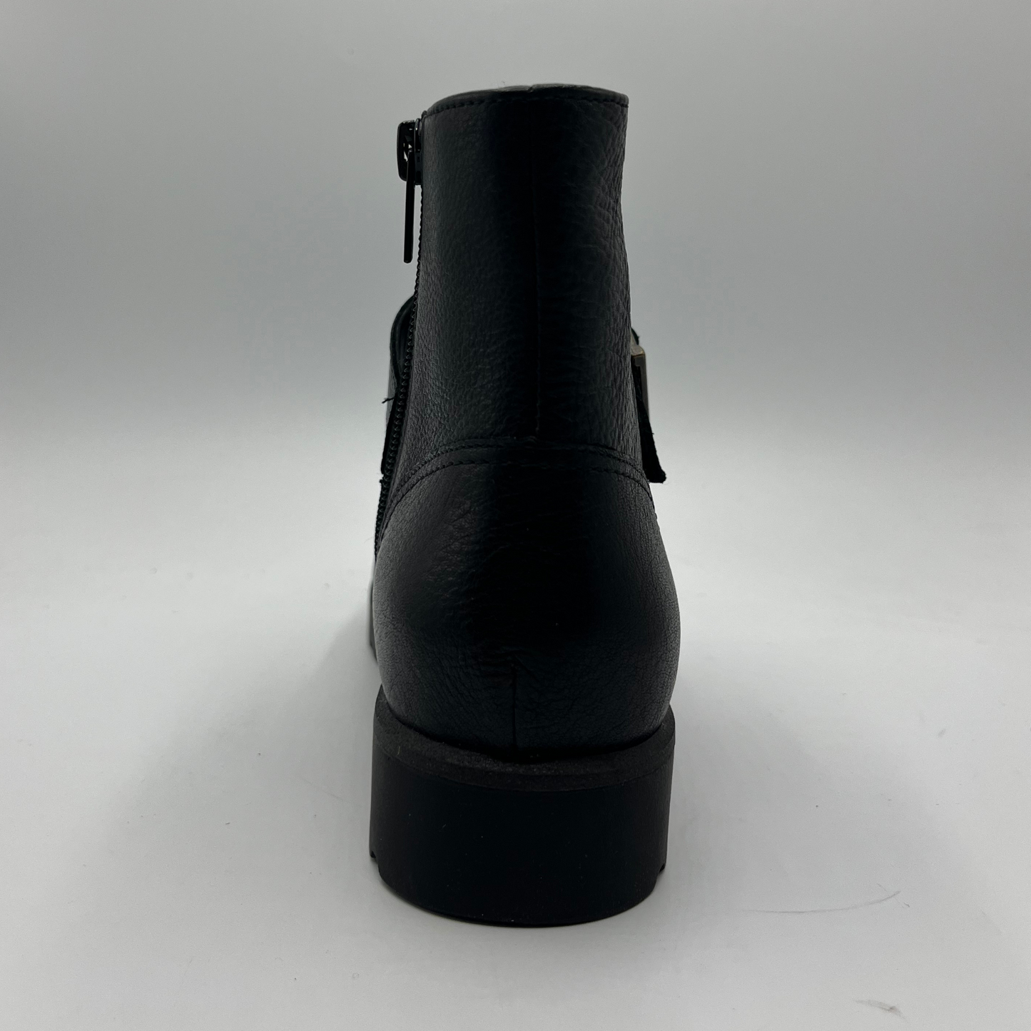 Back view of a black leather ankle boot.