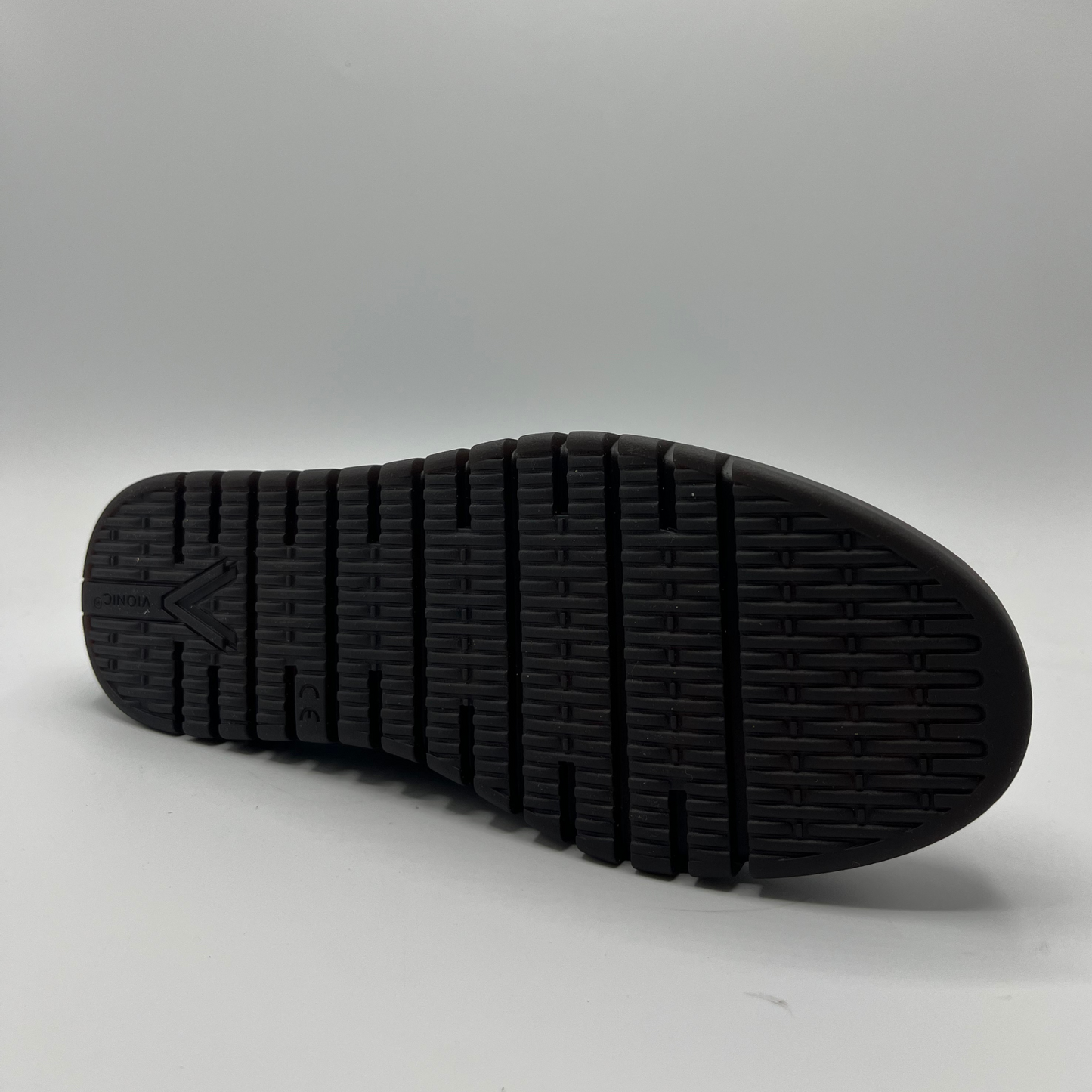 Bottom view of a leopard print suede loafer