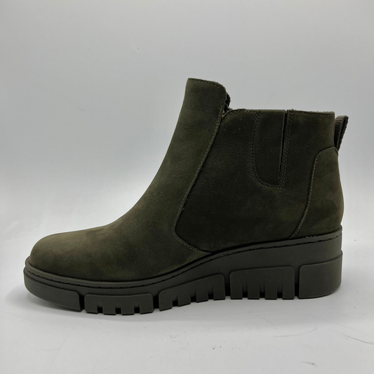 Green ankle boot on a white background