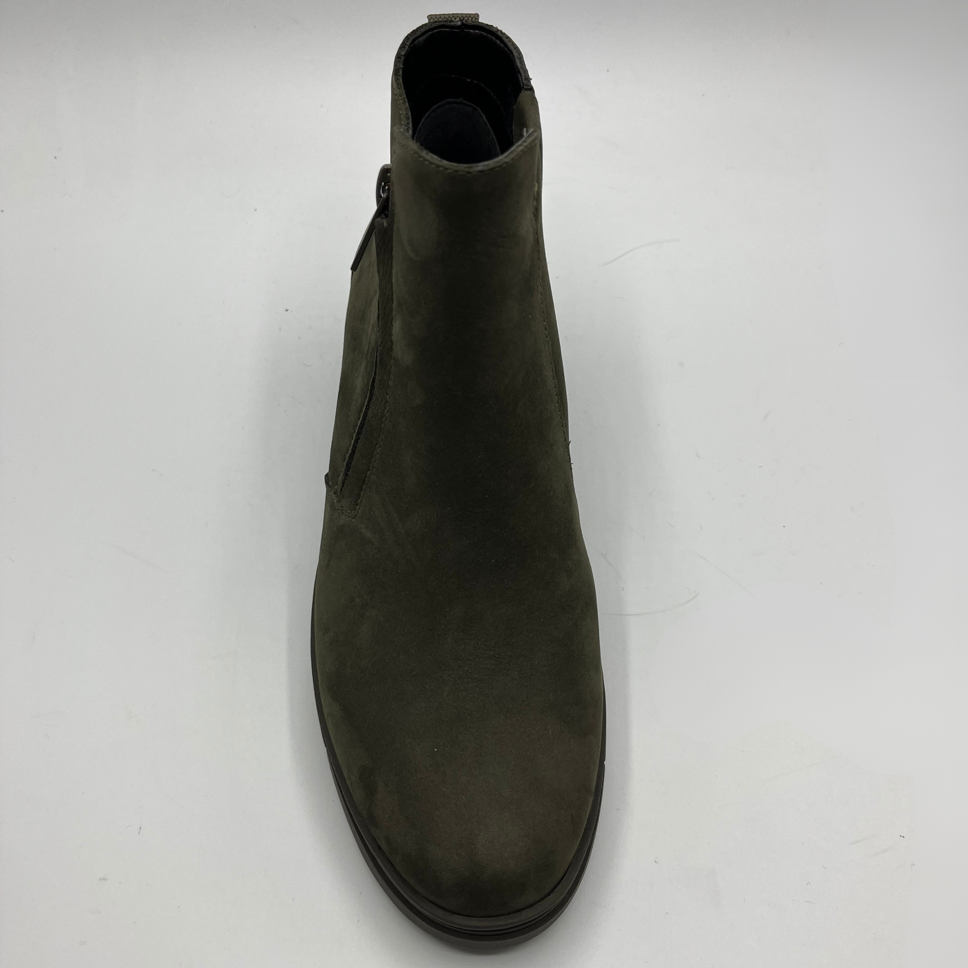 Green ankle boot on a white background