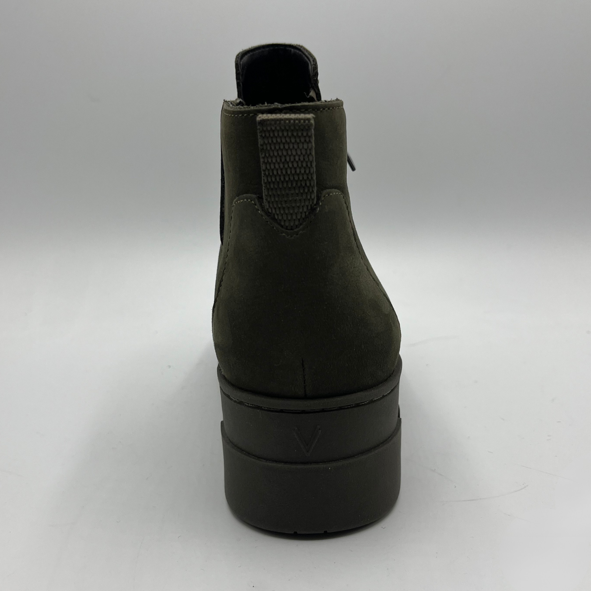 Dark green ankle boot on a white background