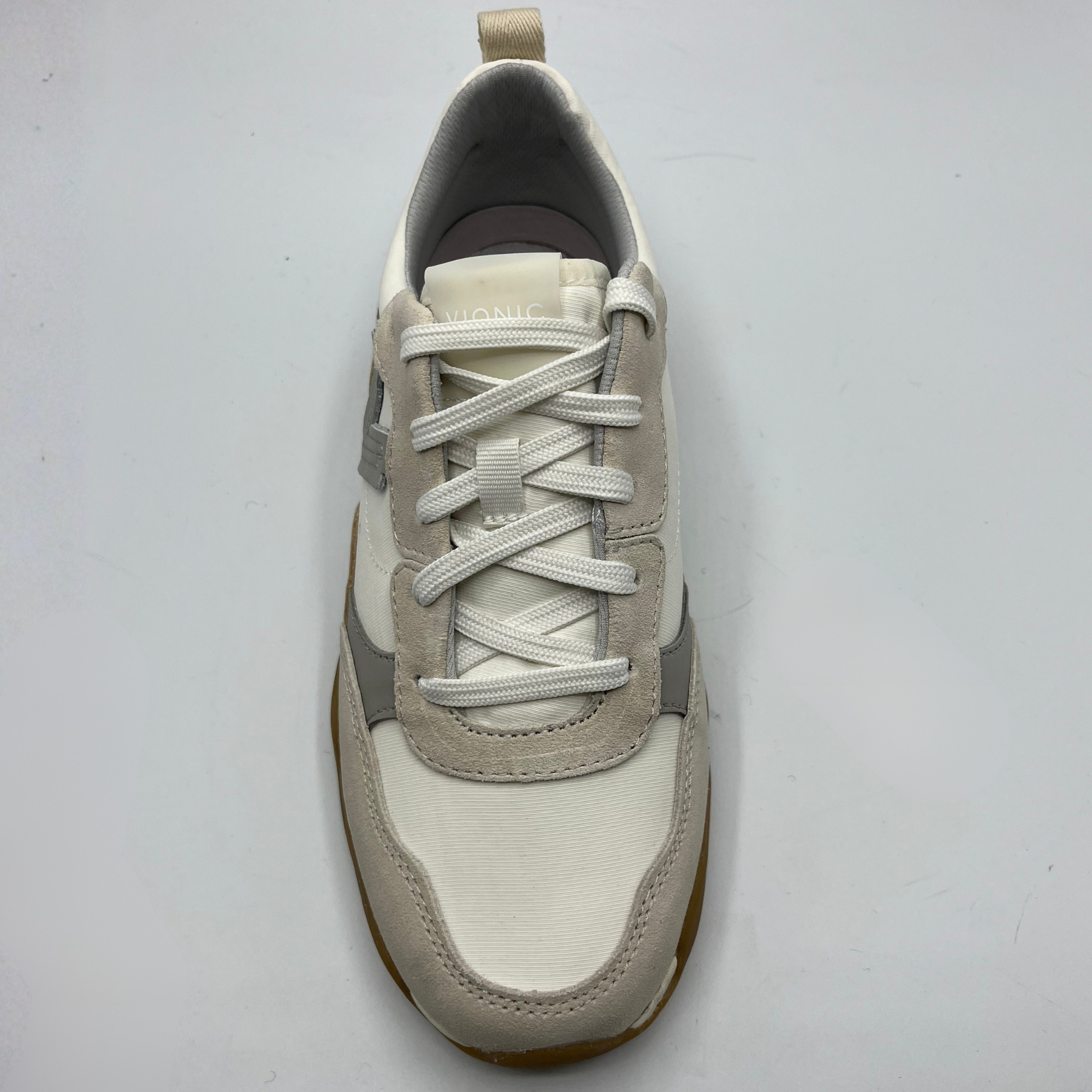 White and gray sneaker on a light gray background