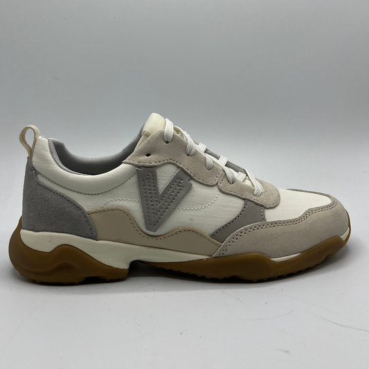 Beige and gray sneaker with brown sole on a white background