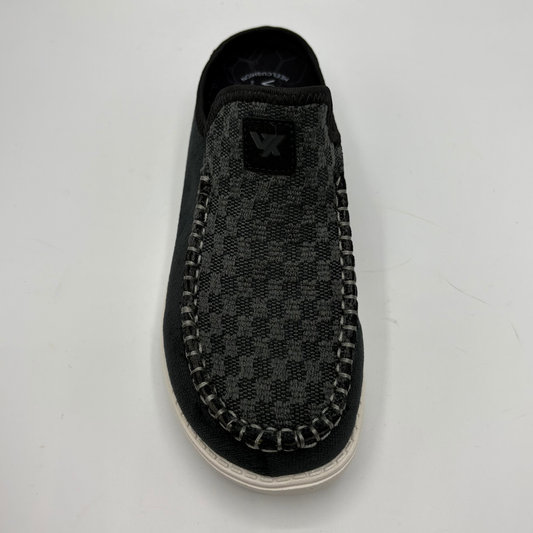 Top view of a black slip on shoe with a white sole
