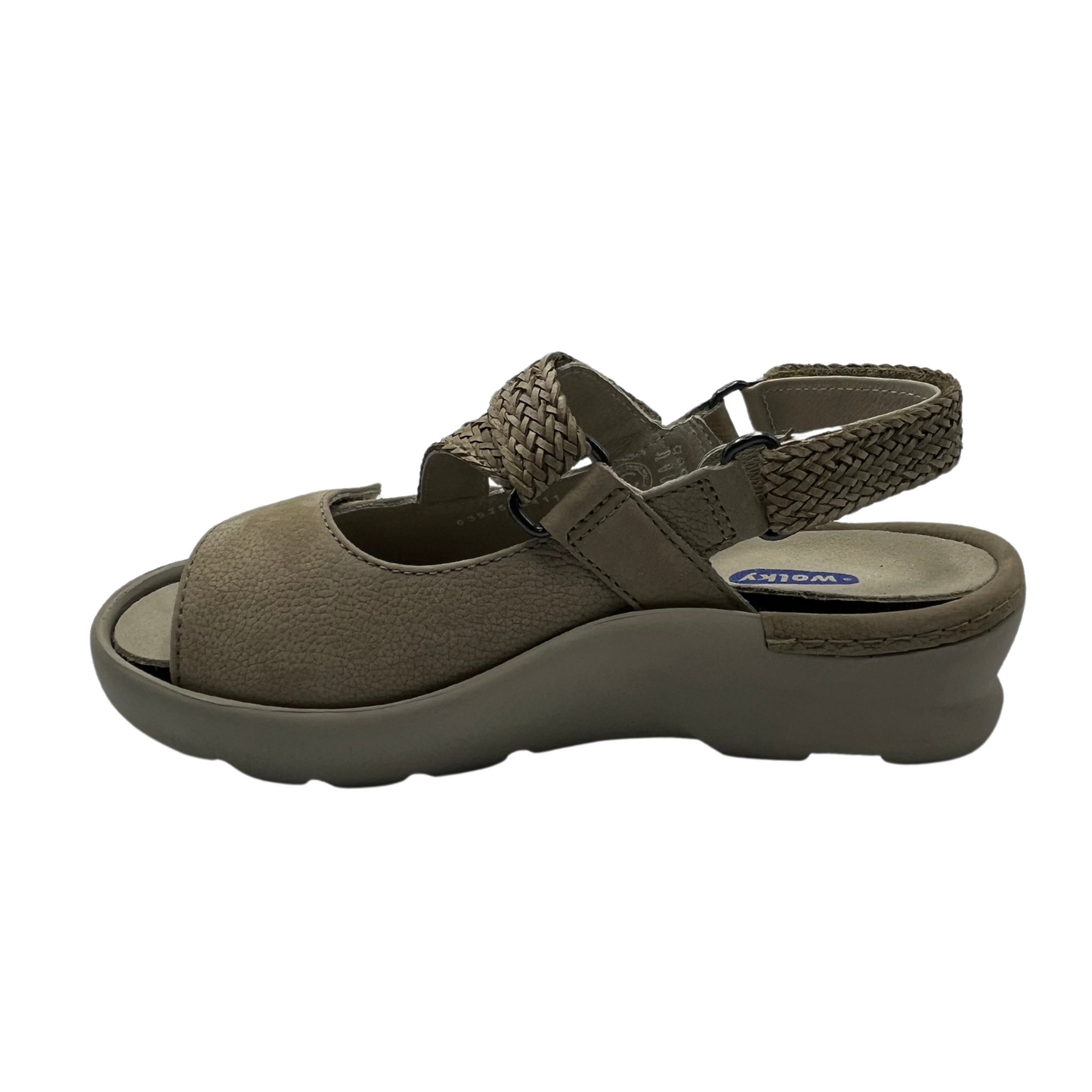 Left facing view of sand coloured sandals with braided style adjustable straps.