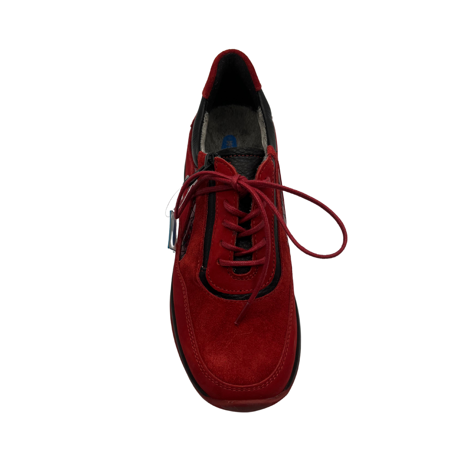 Top view of red leather sneakers with a water resistant upper, laces and side zipper closure.