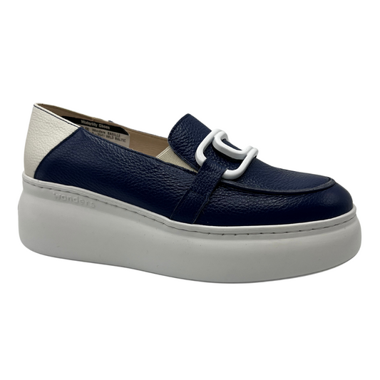 45 degree angled view of navy and white leather loafer with platform sole and large white paperclip detail