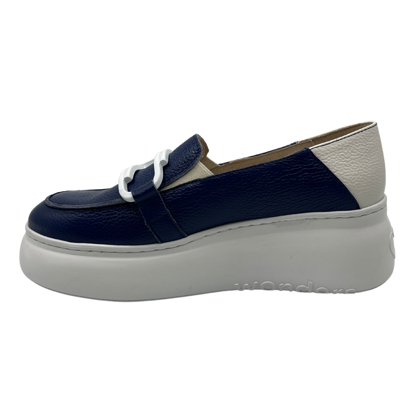 Left facing view of navy and white leather loafer with white rubber platform sole and large white paperclip detail