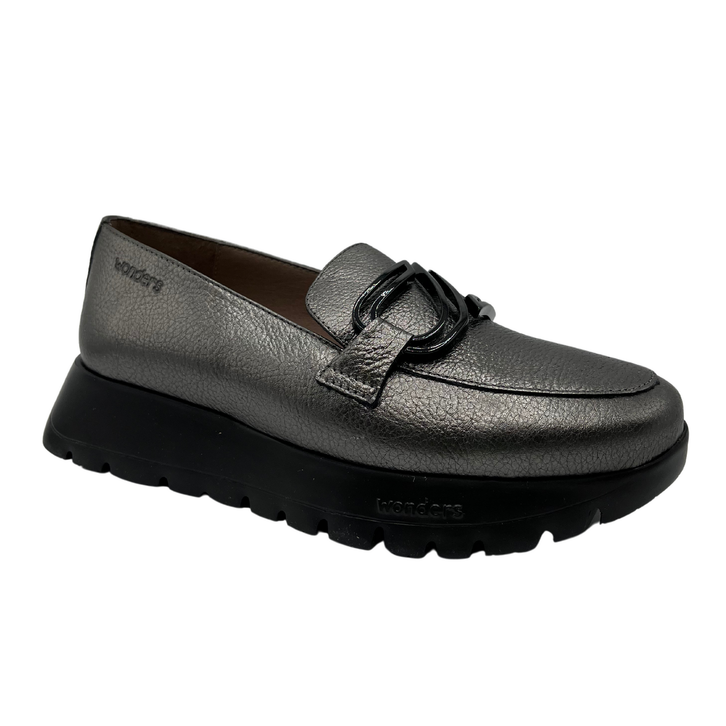 45 degree angled view of textured leather loafer in grey. A black thick platform sole and black embellishment on the upper