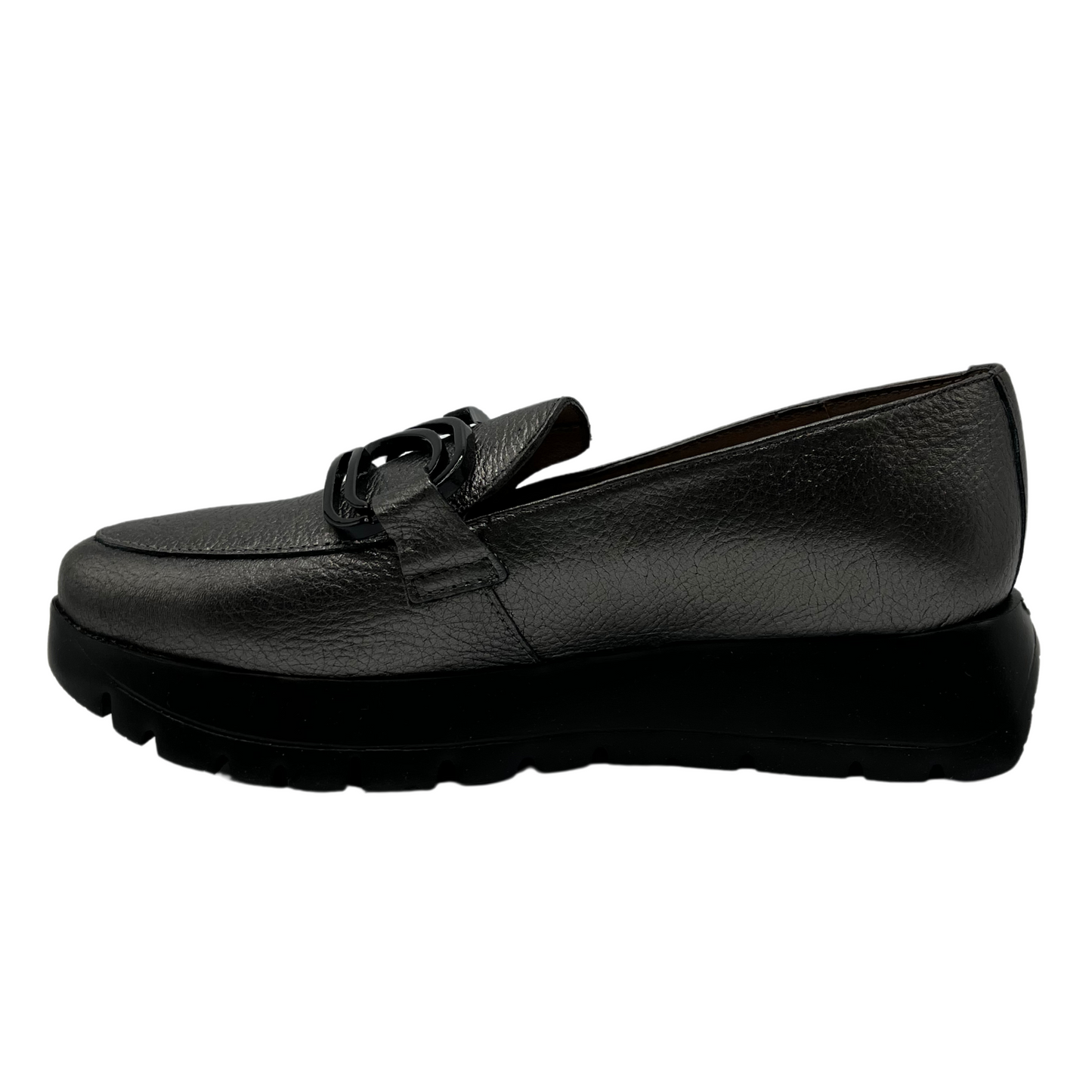 Left facing view of textured leather loafer in grey. A black thick platform sole and black embellishment on the upper