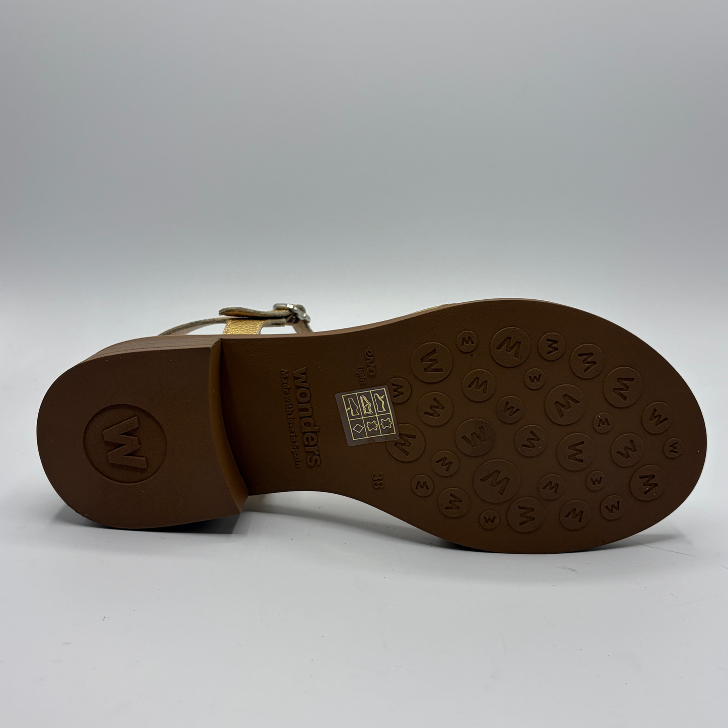 Brown sandal sole with brand logo on a white background