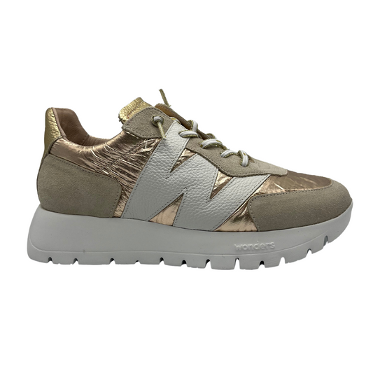 Right facing view of gold coloured sneaker with a suede and leather construction. Extra lightweight thick rubber outsole and a white W on the side.