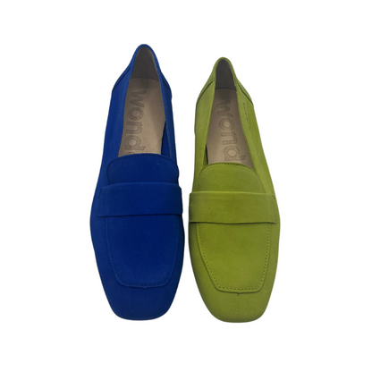 Top view of a pair of suede leather loafers from the top. One is blue and one is apple green. Both have square toes and beige lining