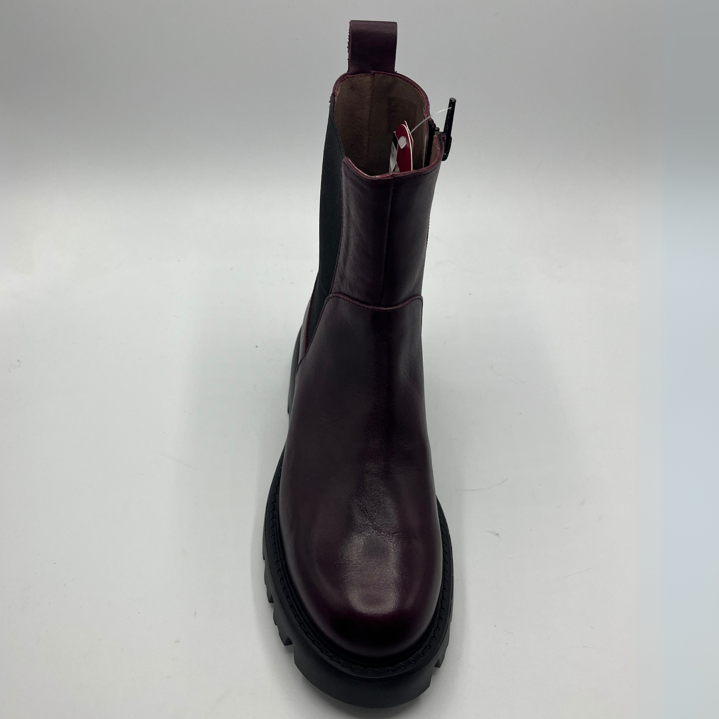 Dark wine leather boot on a white background