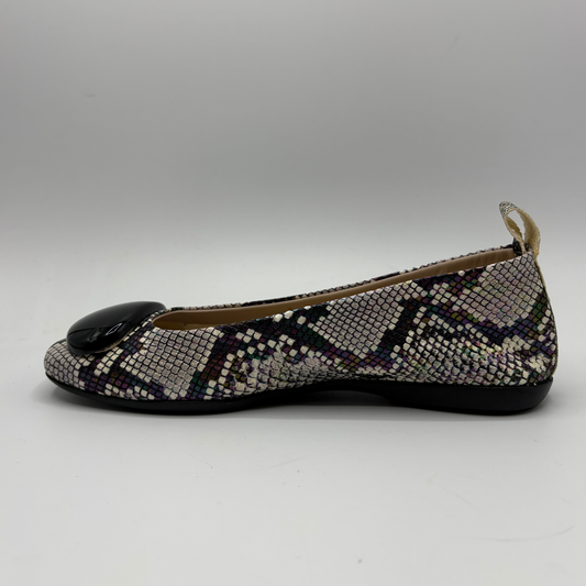 Flat shoe with snake print pattern on a gray background