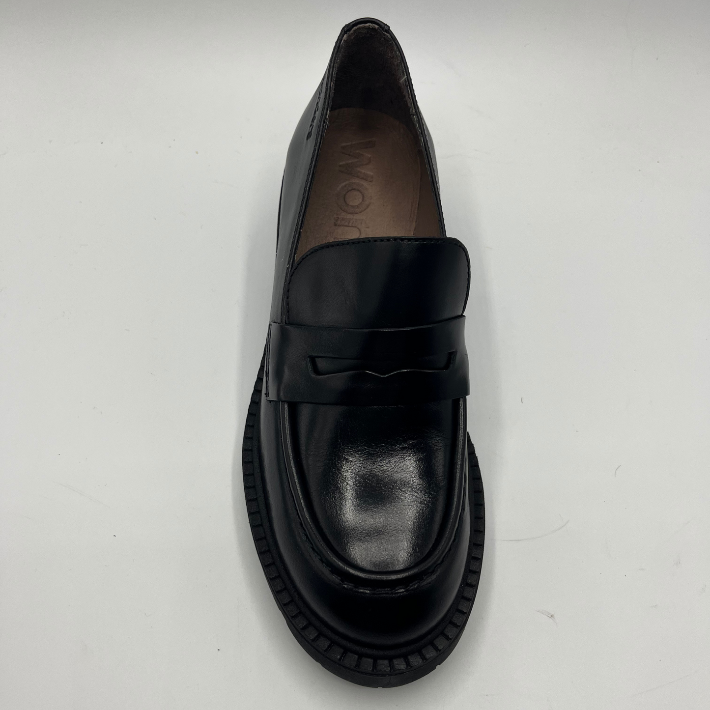 Black loafer shoe on a white background