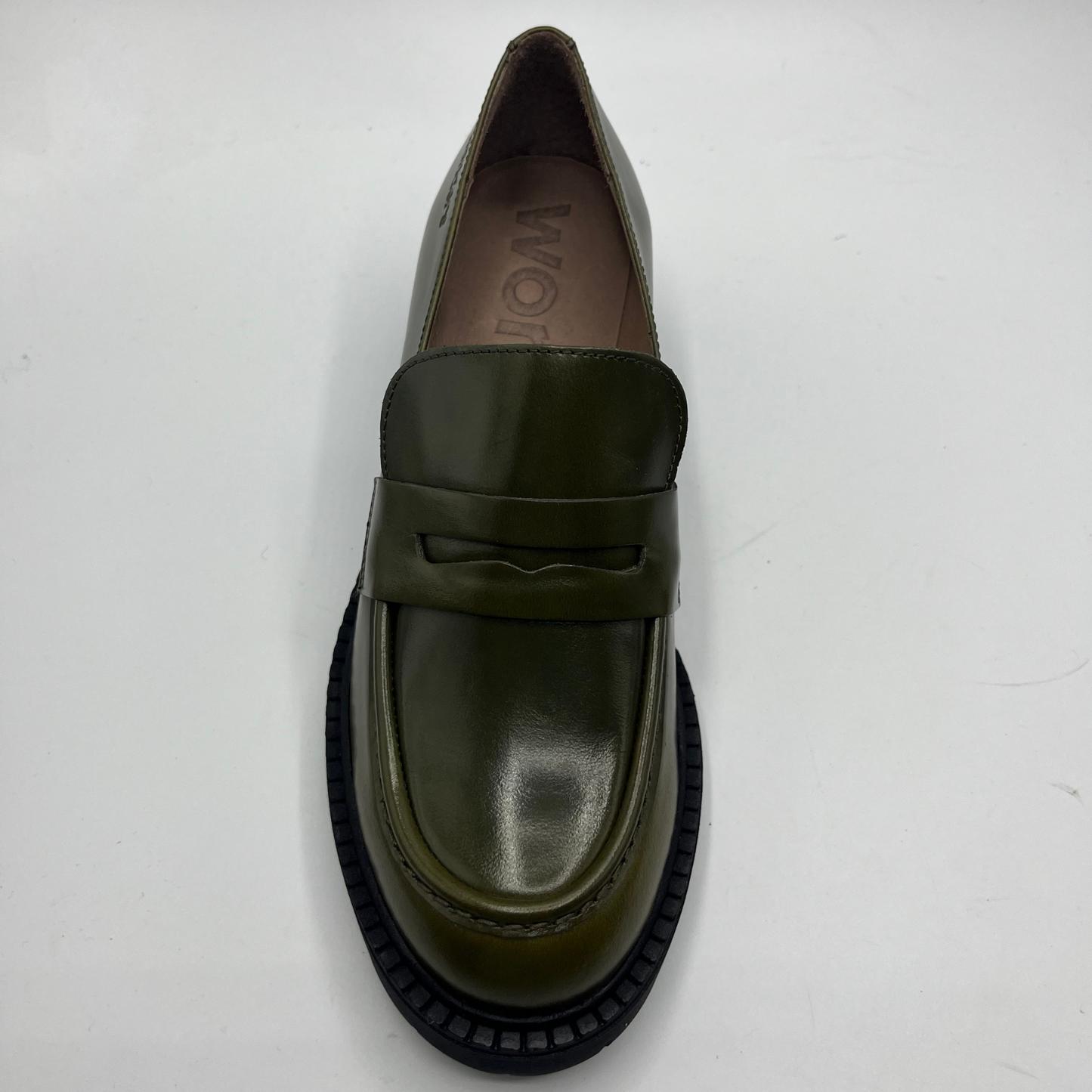 Green loafer shoe on a white background