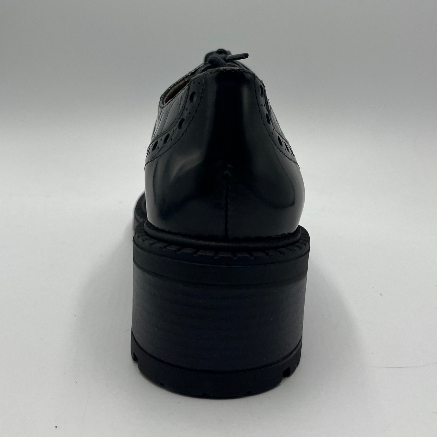 Black dress shoe on a white background