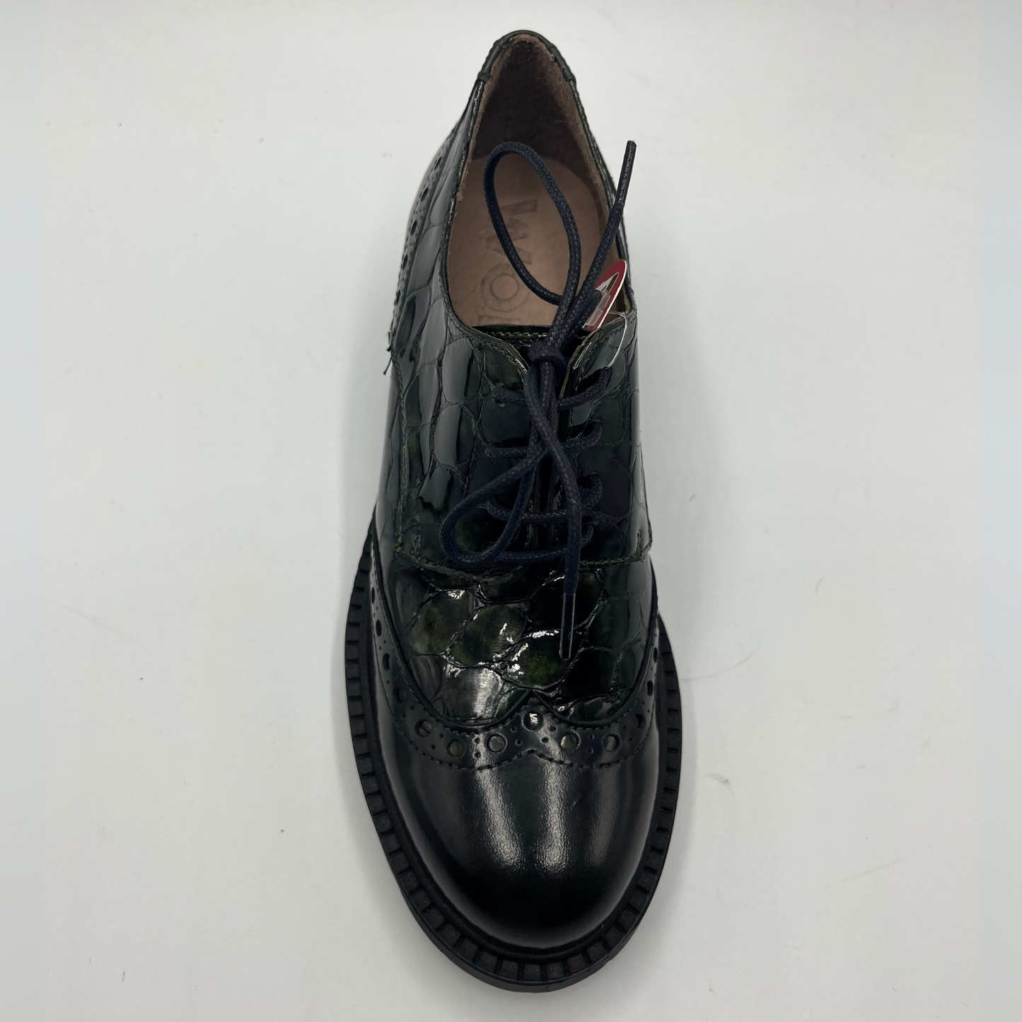 Black leather shoe with lace-up design on a white background