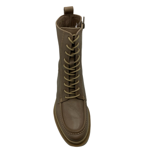 Top view of short leather boot with rounded toe and contrasting laces