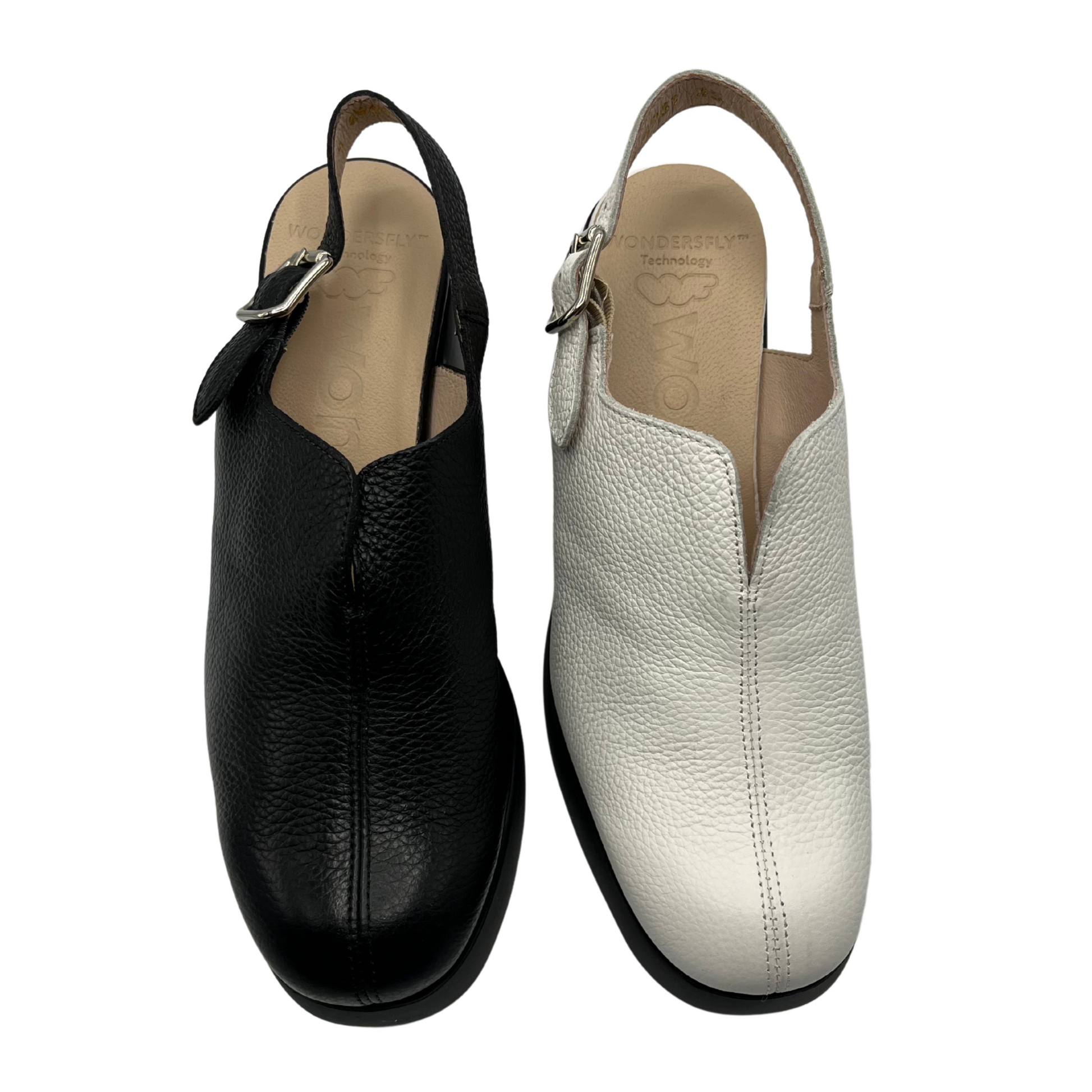 Top view of two heeled shoes beside each other. One is black and one is white. Both have a slingback strap, leather lining and rounded toe.