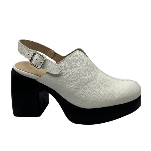 Right facing view of white leather shoe with a sling back strap with a black chunky platform heel and sole