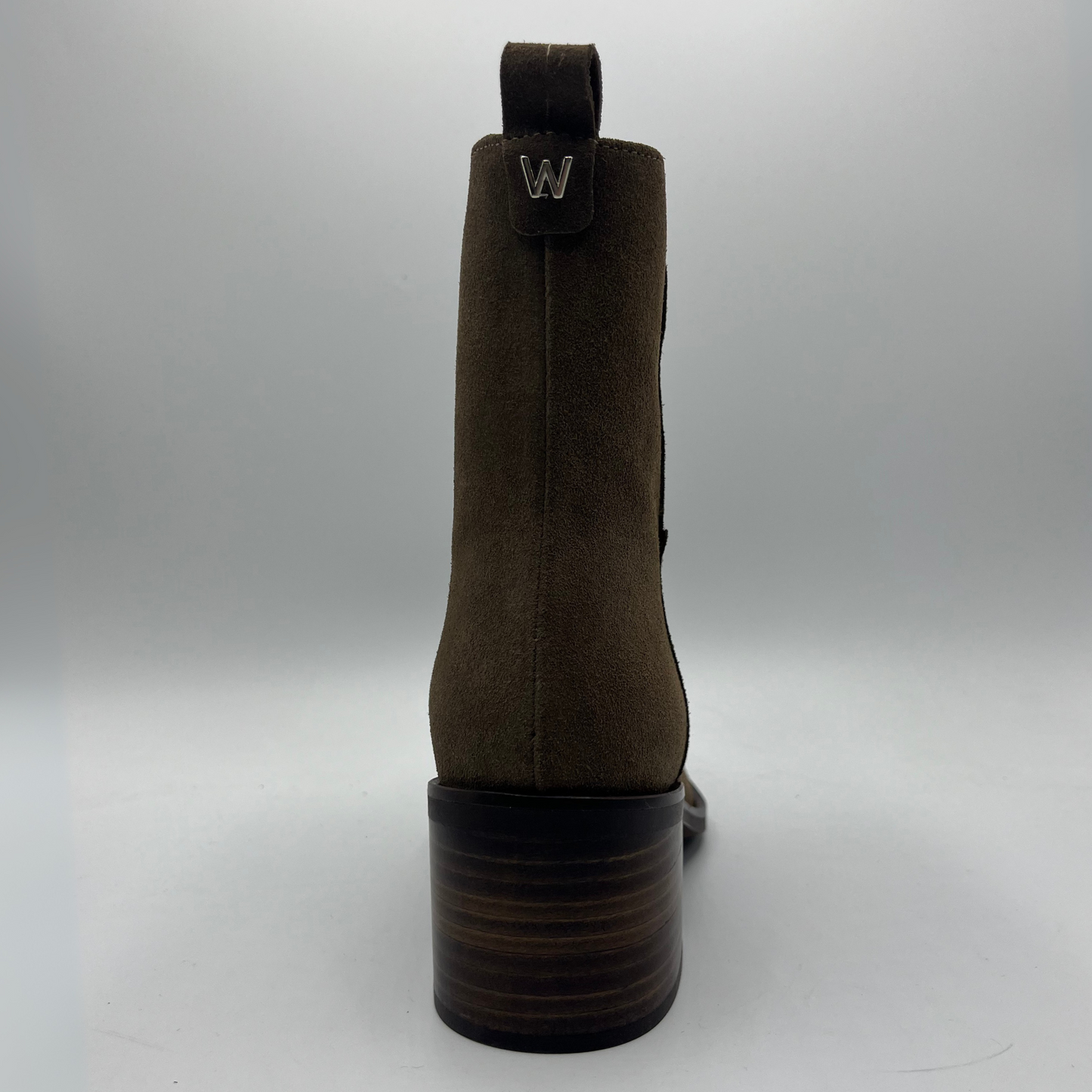 Brown boot with a brand logo on a gray background