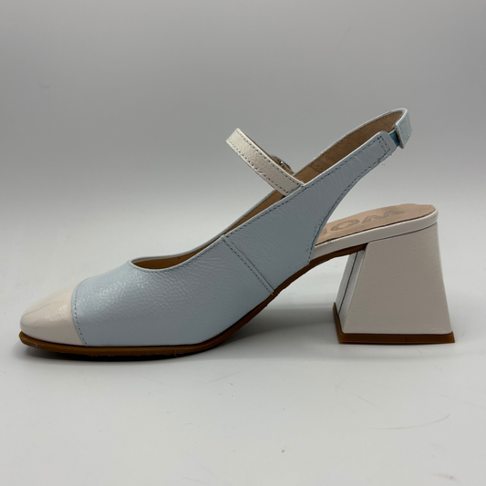 Light blue shoe with a block heel on a white background
