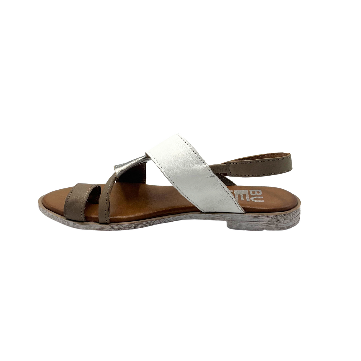 Inside view of a slip on style sandal shown in a white combo leather. Flat with toe lopp at front. Straps across top and midfoot as well as heel