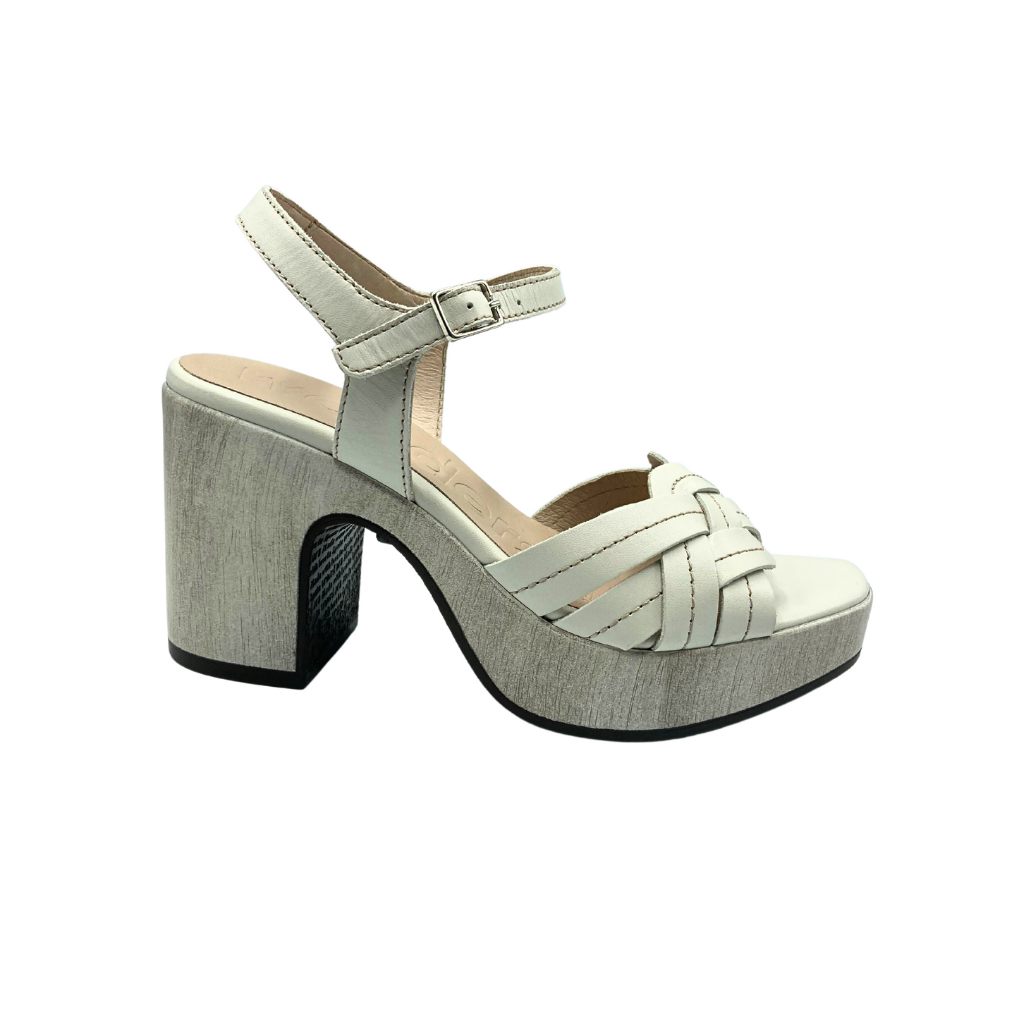 Outside view of a platform sandal. Shown in a creamy white leather. Platform/heel is a shade darker than upper and has a slight pattern. Woven straps at front and adjustable ankle strap