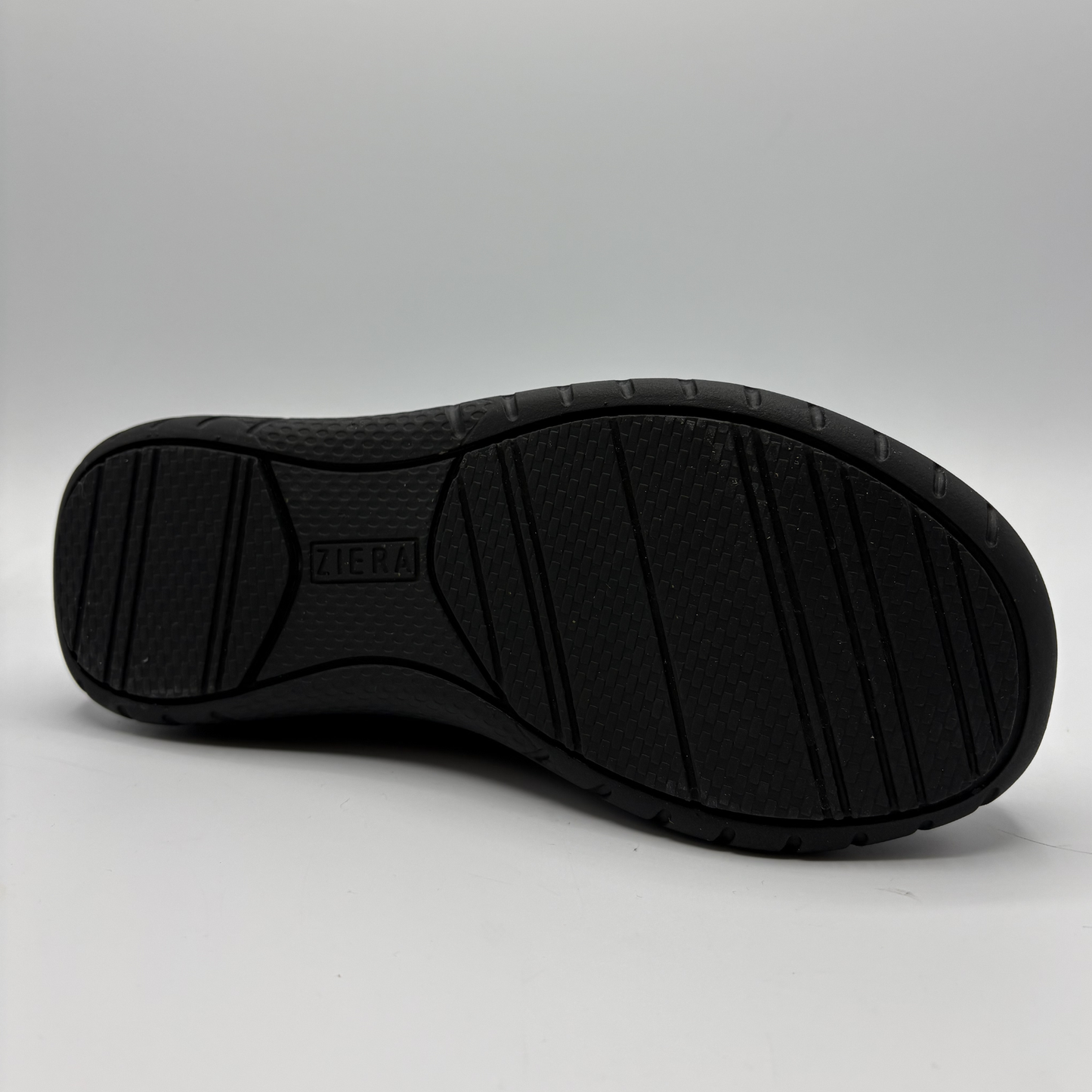 Black shoe sole with 'Ziera' branding on a gray background