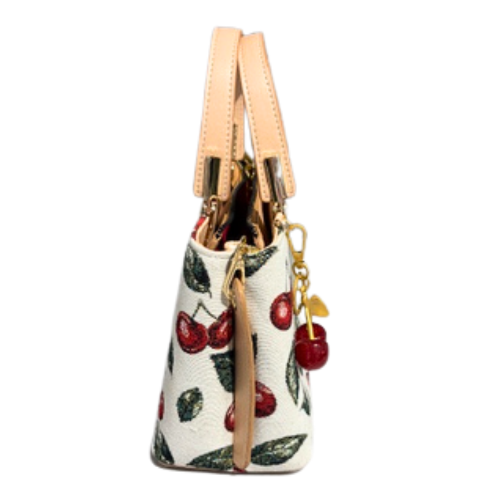 Handbag with cherry design on a white background