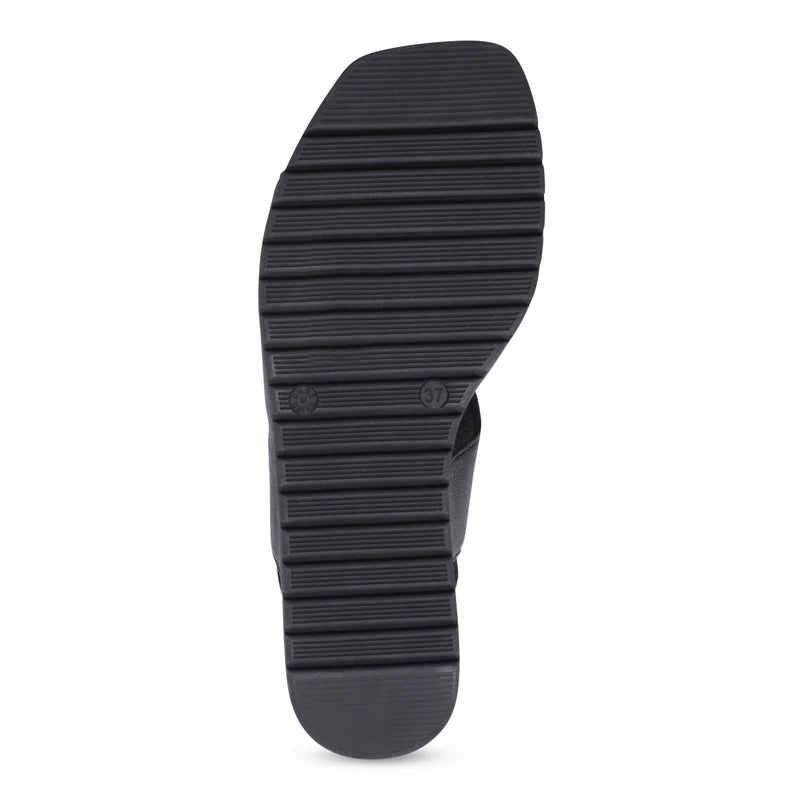 Black rubber sole of a shoe on a white background