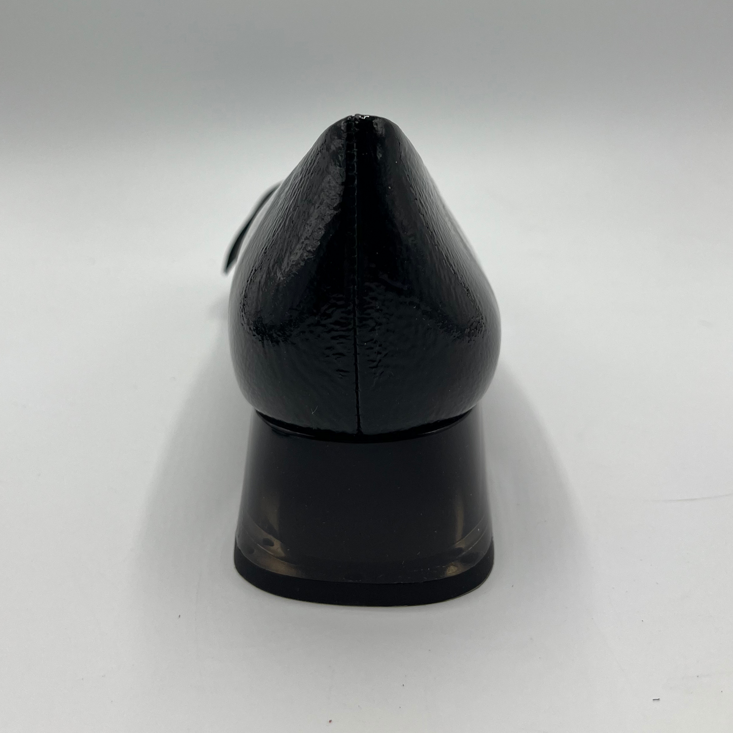 Black high-heeled shoe on a white background