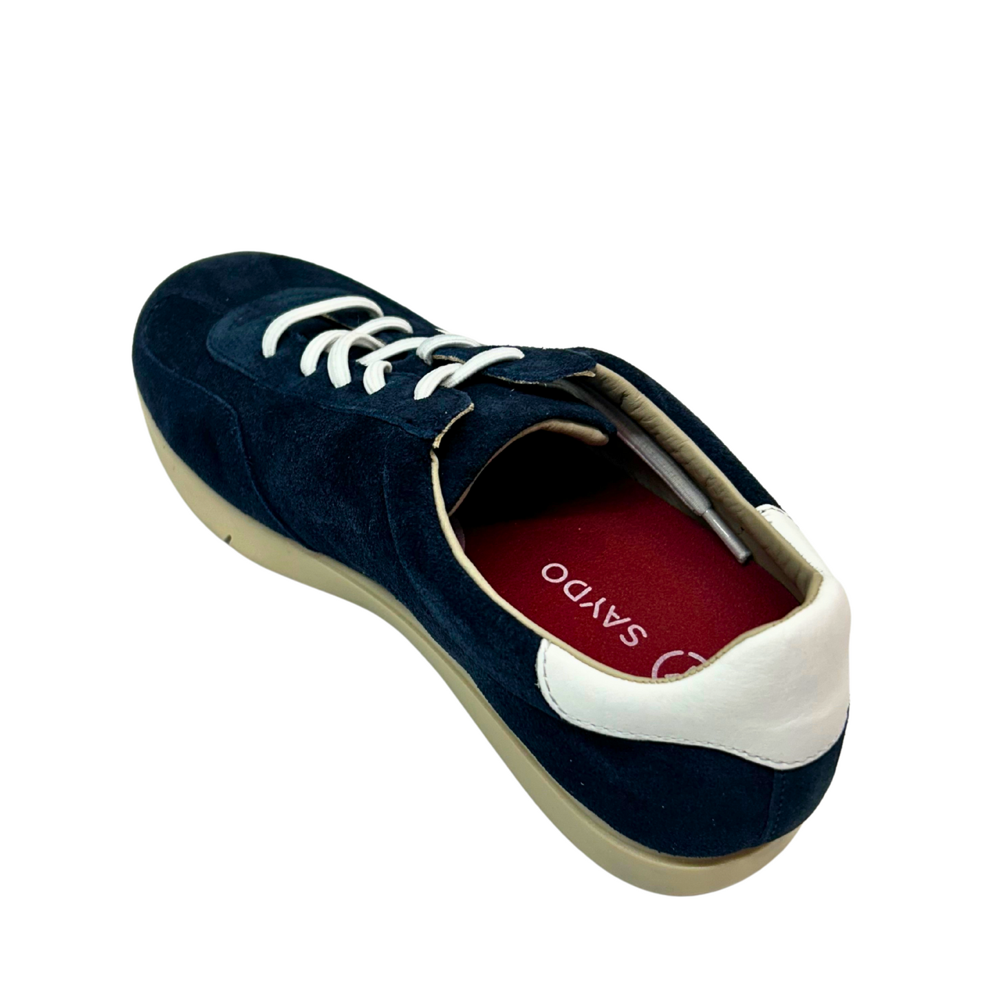 Navy blue shoe with white laces and sole on a white background