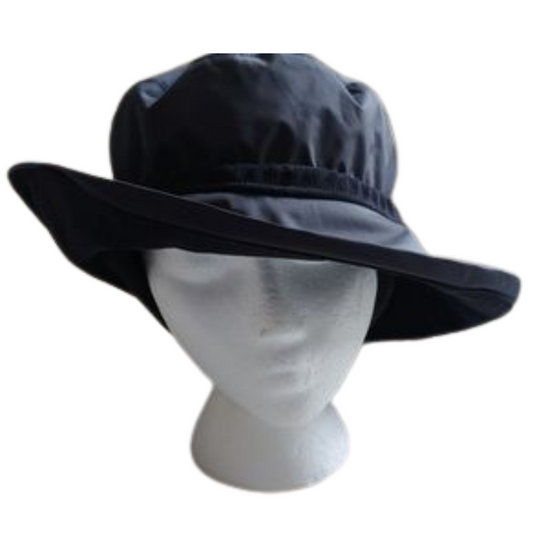 A photo of the drawstring rain hat in the colour navy, In this photo it shows how the hat fits on a head.