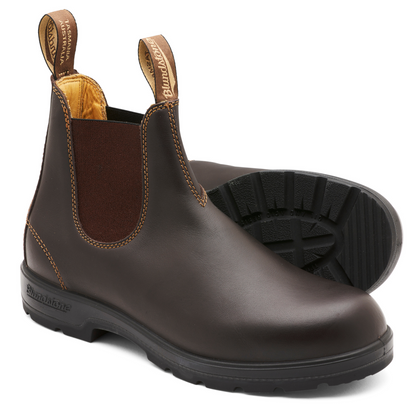 A pair of walnut brown leather boots with black soles. Tan coloured, leather, interior lining.