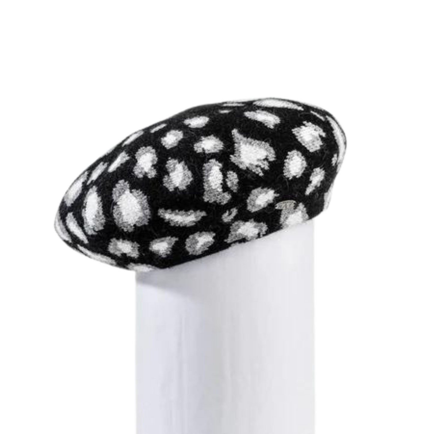 A photo of the beret displayed, showing the leopard print and the fit on the hat.