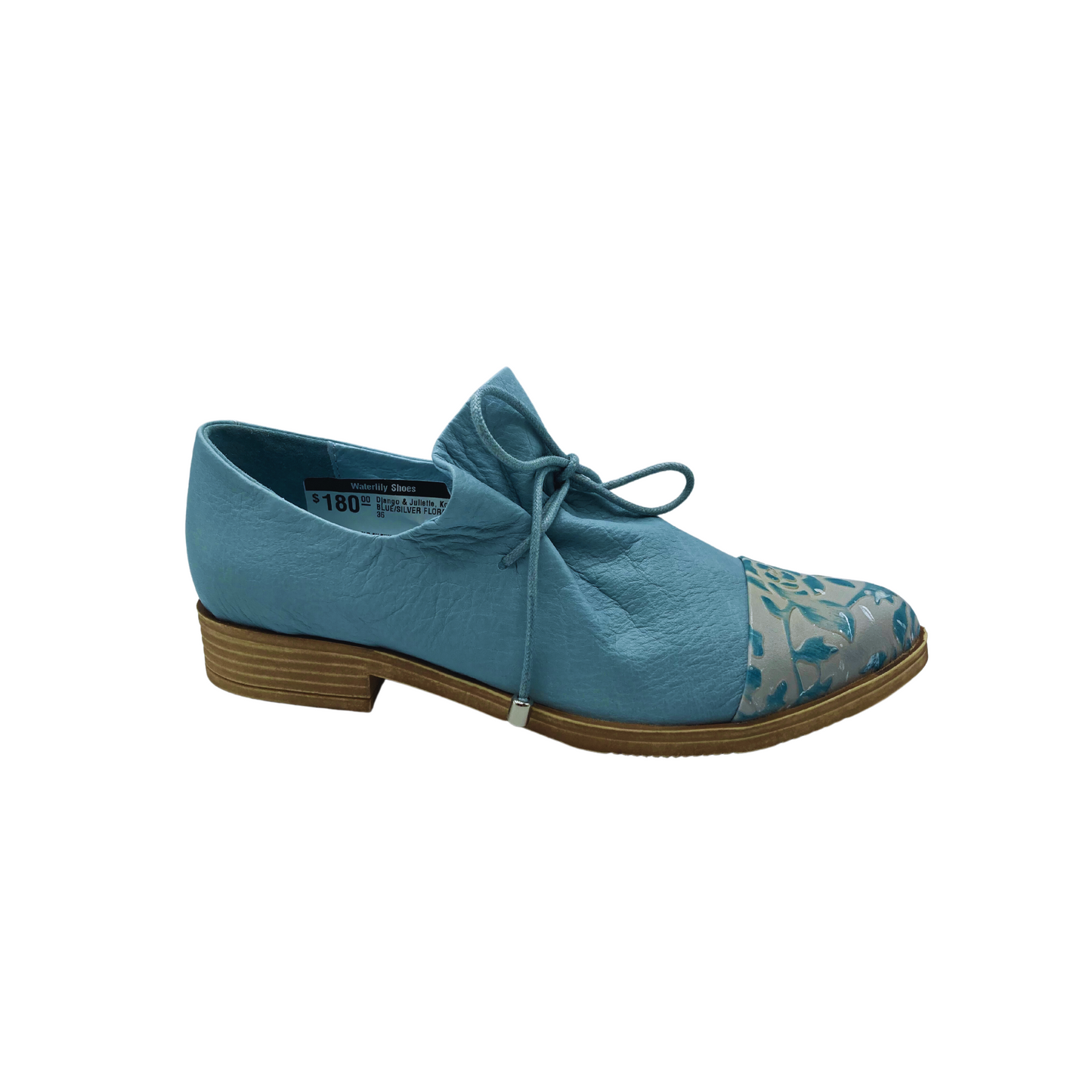 Outside viewof Django Kotty in denim/silver. Body of shoe is denim with a toe cap in blue/silver. Ruched tongue held together with laces