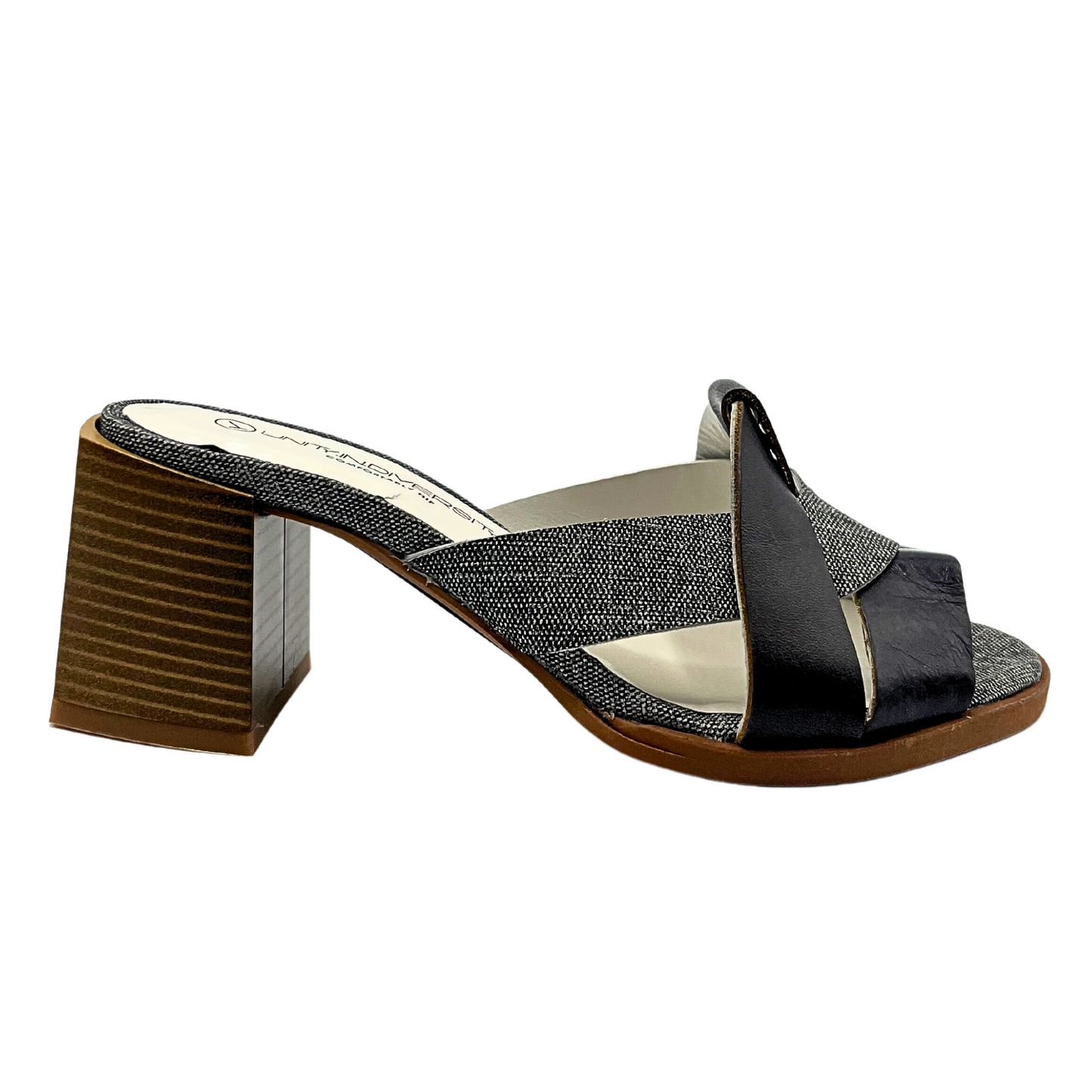 Outside view of the Soryal mule. Black/grey upper is contrasted with a wood outsole and heel