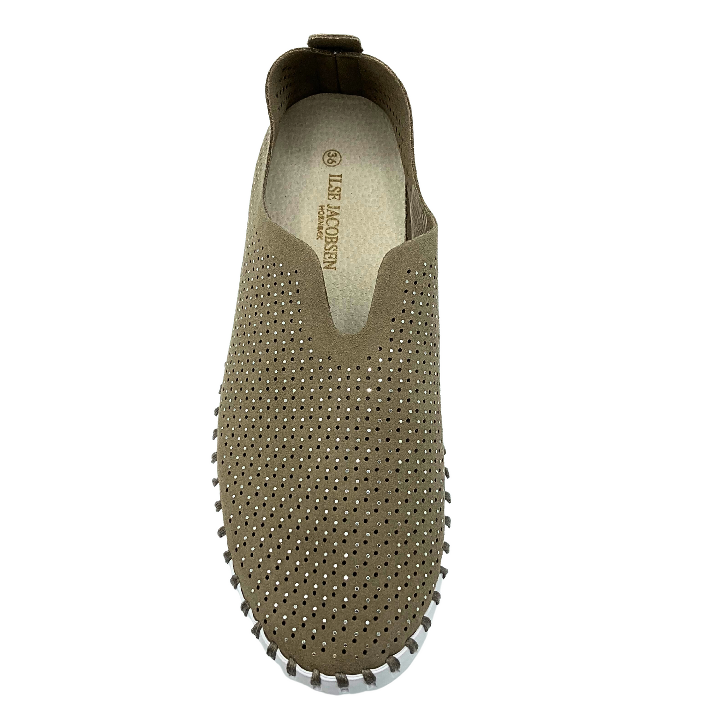 Top down view of a slip on sneaker with a white rubber sole. Upper is a recycled microfibre with laser cut outs and crystals.