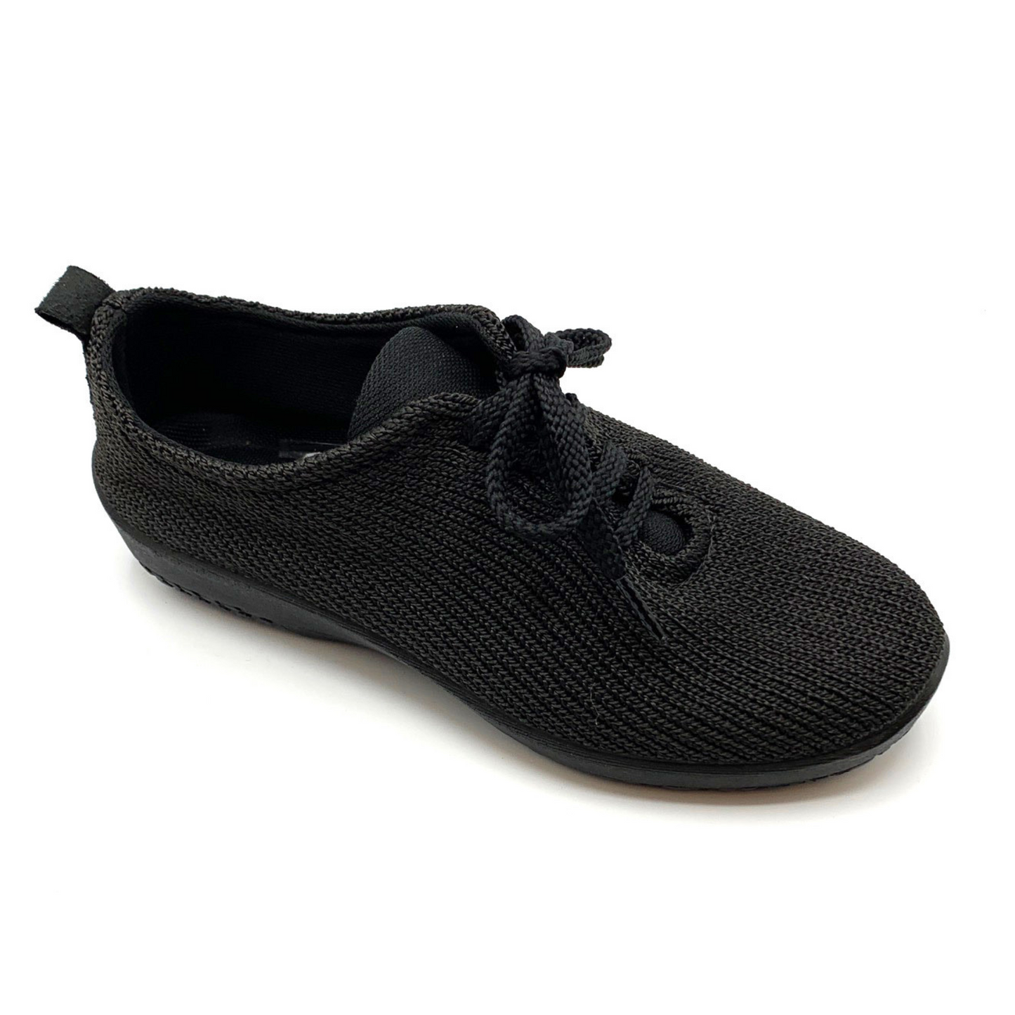 Solid black knit sneaker pictured at an angle with top shoestrings and tongue visible.