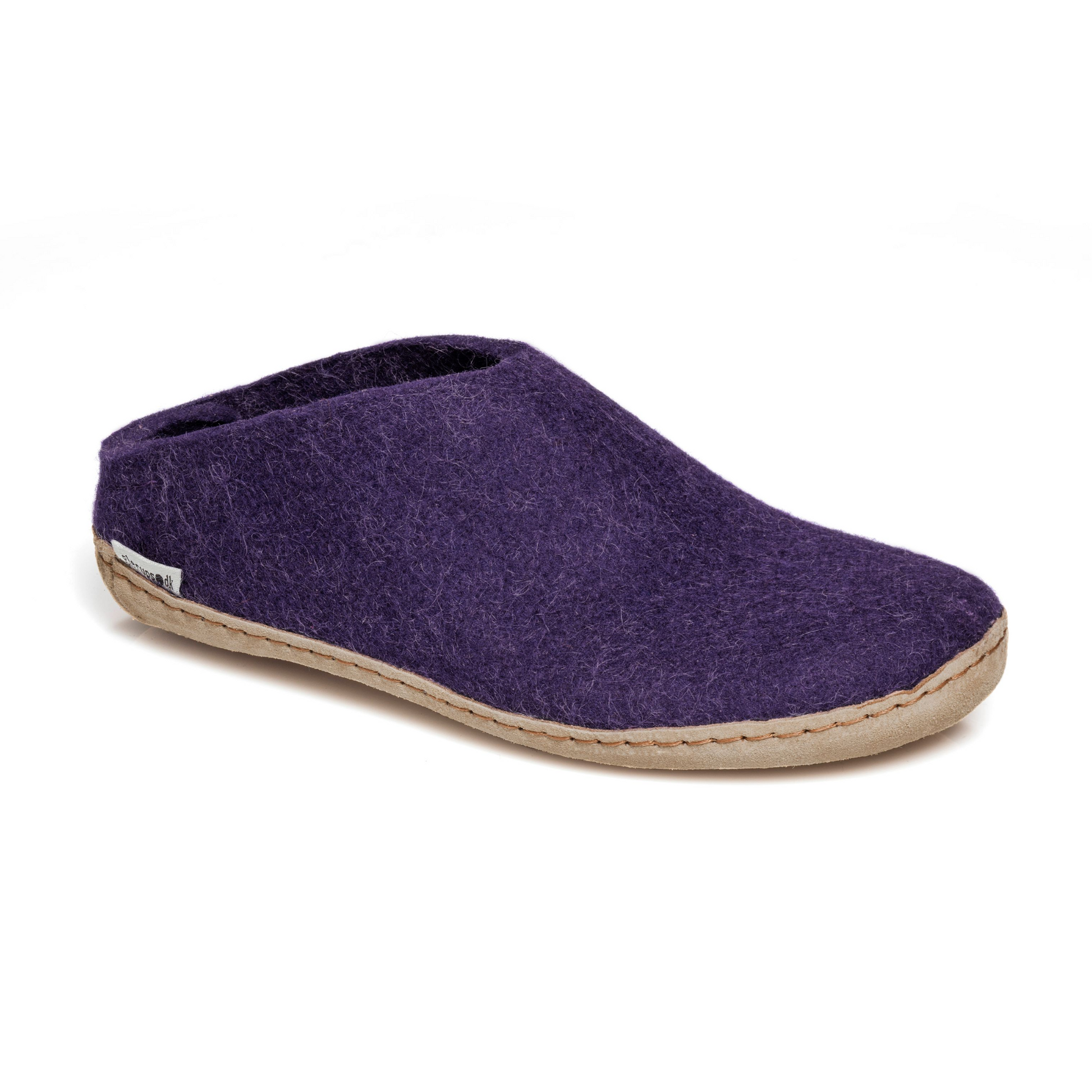 A purple felted slipper with low back is pictured from an angle. It's sole is lined in stitched tan leather.