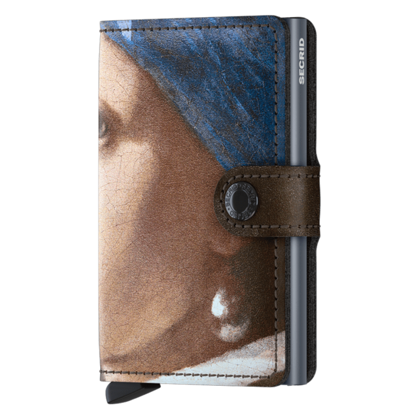 A wallet is pictured with part of Vermeer's "Girl with the Pearl Earring" including an inner blue metallic cardholder and brown strap button closure.