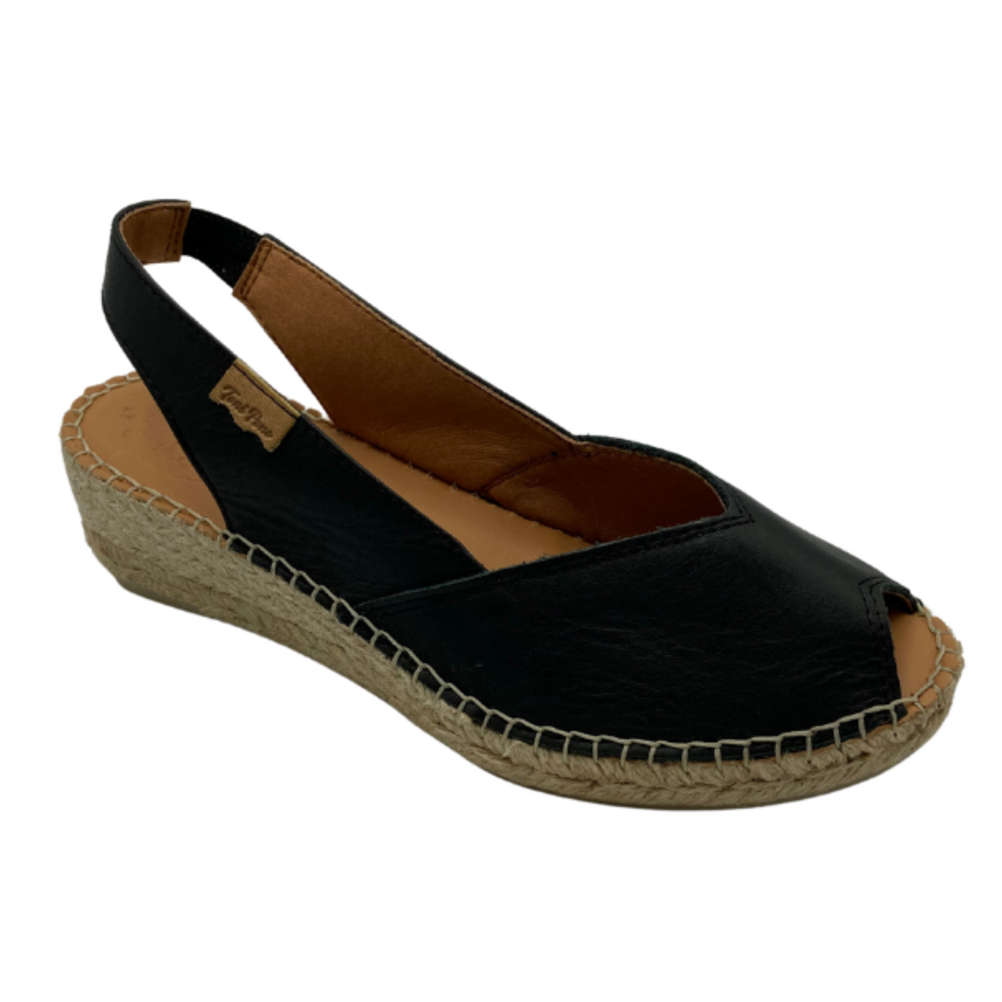 Angled side view of a black leather espadrille. Low wedge sole, peep toe and open heel with a back strap