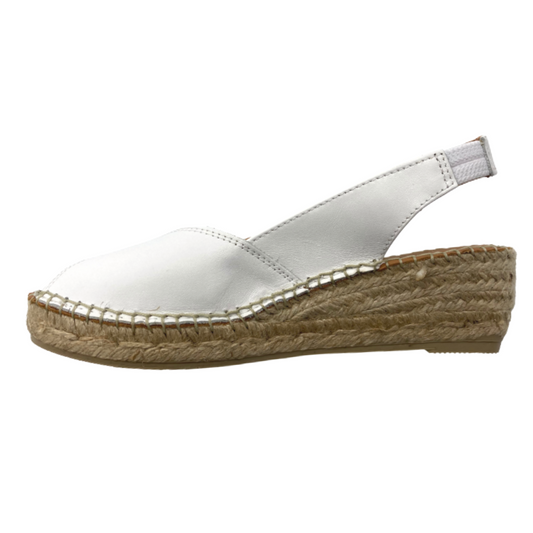 Inside view of a white espadrille sandal. Peep toe front and open heel. Slip on style but does have a back strap with an elastic for best fit. Sole is a braided rope