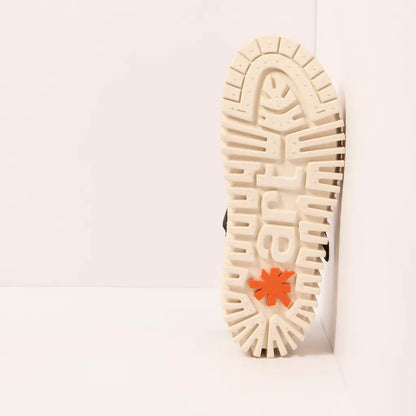 Close-up of a shoe sole with the ART logo on a white background