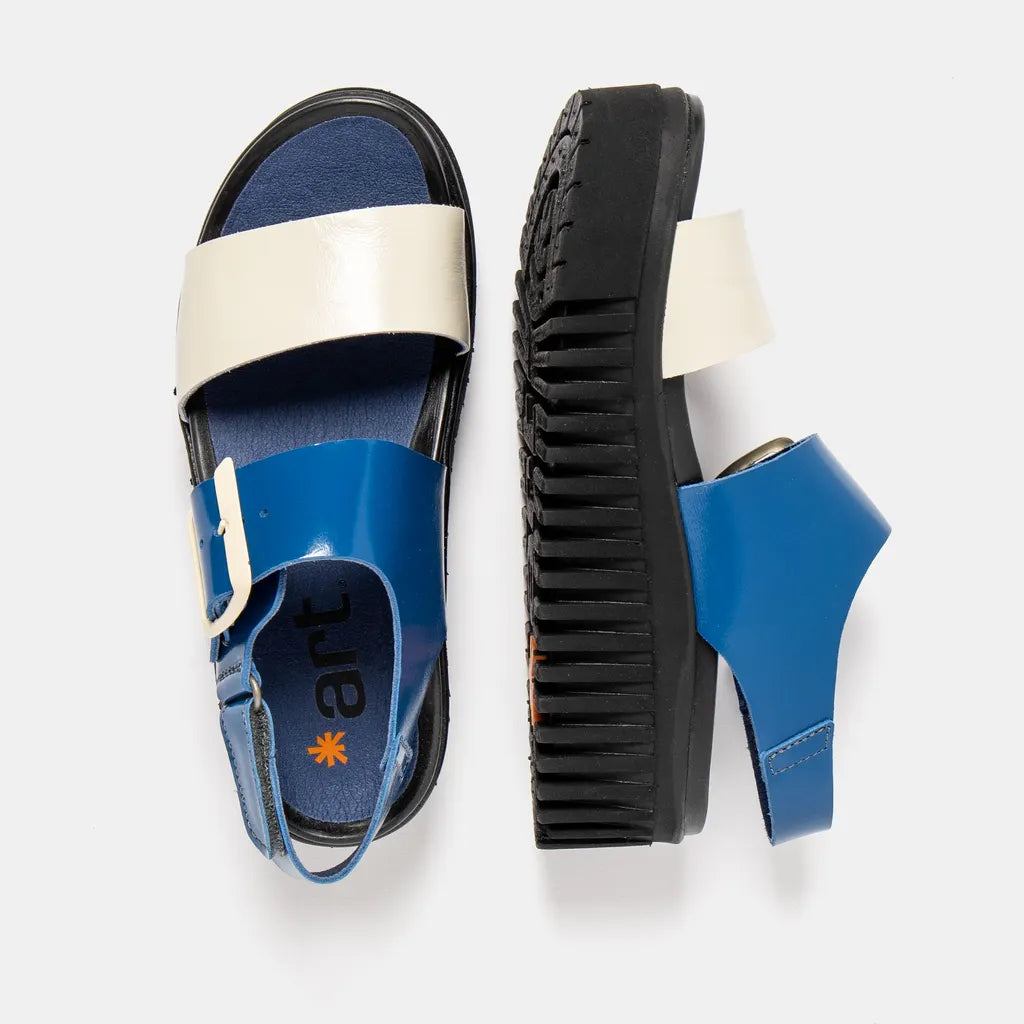 Blue sandal with white strap on a light gray background