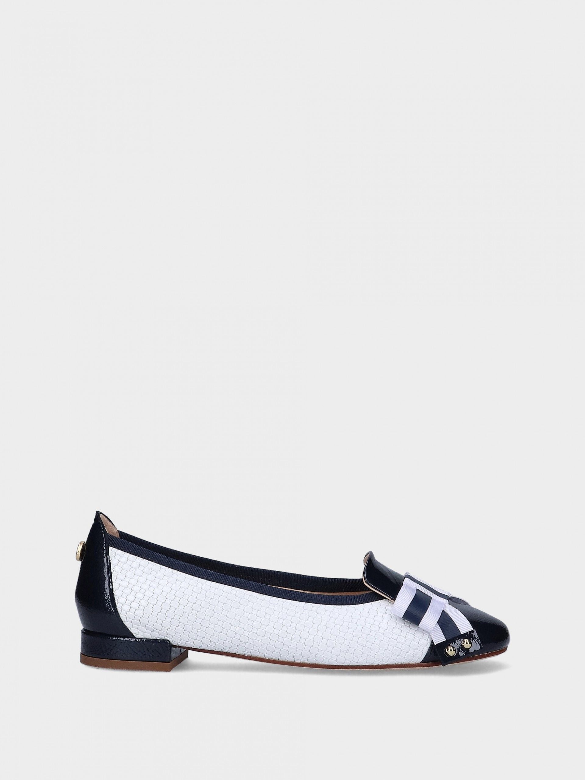 Navy and white flat shoe on a light gray background.  Available at Waterily Matticks.